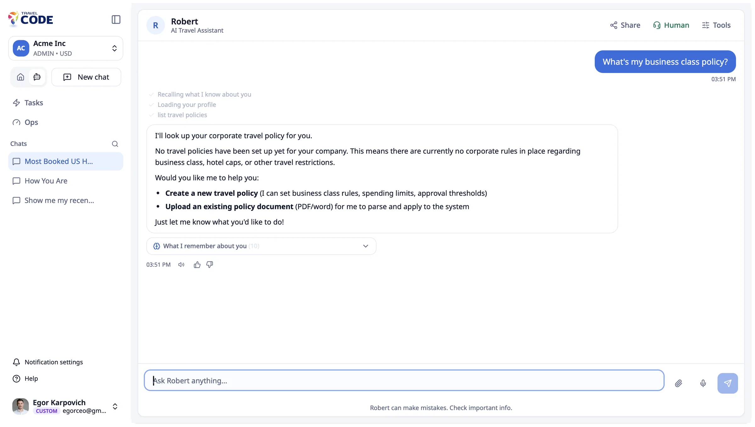 Robert, the AI travel assistant, explaining the company business-class policy in chat